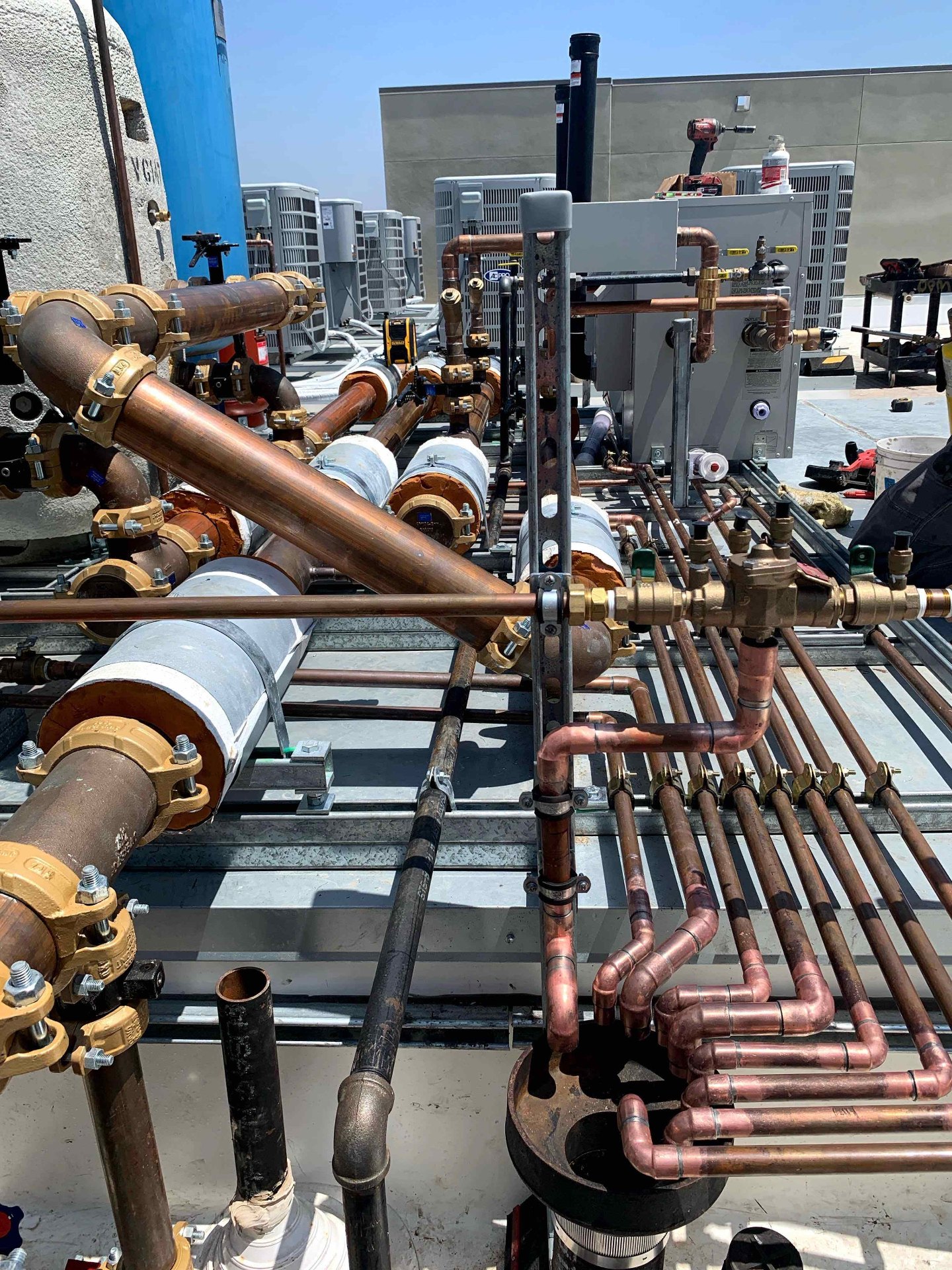 Commercial rooftop copper plumbing manifold installed by BluePoint Plumbing in Santa Clarita